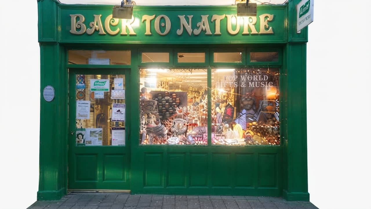 The green shopfront of Back to Nature, with gold lettering and a window of world gifts and music